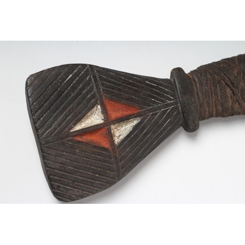 478 - A LARGE PAPUA NEW GUINEA HAGAN AXE with stone head, painted and carved rear head, wrappings and tape... 