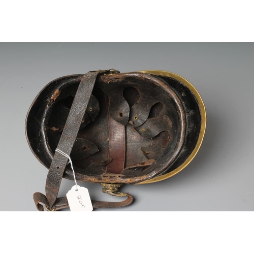 483 - AN AUSTRIAN FIREMAN'S LEATHER HELMET with brass crest, badge, lion head bosses and leather chin stra... 