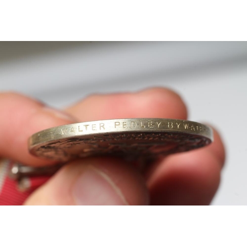 499 - A BRITISH EMPIRE MEDAL awarded to Walter Pedley Bywater, with red and white ribbon, spare ribbon and... 