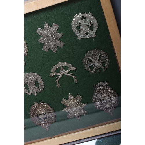 515 - THIRTY FOUR BRITISH MILITARY CAP BADGES comprising all Scottish regiments in two framed cases