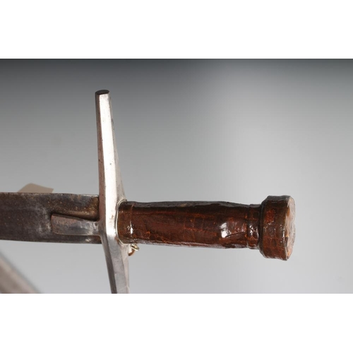 535 - TWO AFRICAN HAUSA SWORDS comprising one of typical form with steel crossguard and leather grip, and ... 