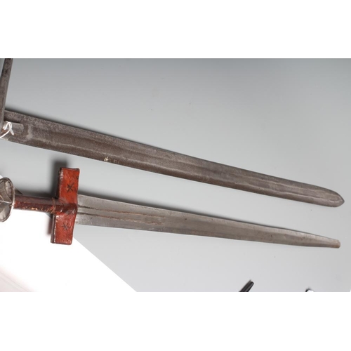 535 - TWO AFRICAN HAUSA SWORDS comprising one of typical form with steel crossguard and leather grip, and ... 