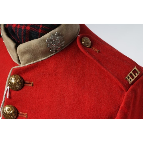 566 - A HIGHLAND LIGHT INFANTRY RED TUNIC, together with a Royal Highland regimetal sporran, and a 