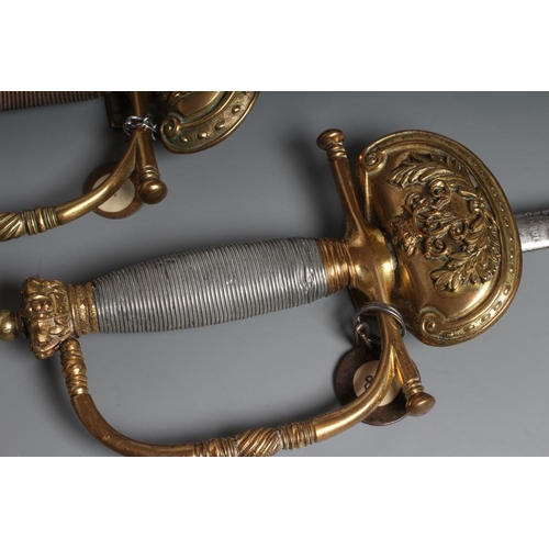 567 - TWO VICTORIAN BRITISH COURT SWORDS, both with brass hilts, shell guards, straight quillon and crown ... 