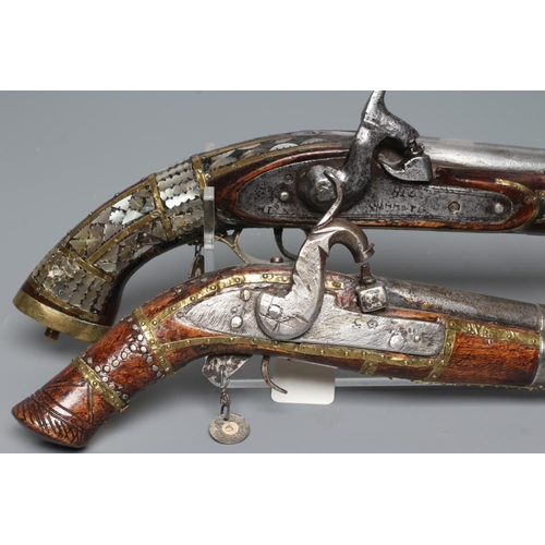 577 - TWO AFGHAN PERCUSSION PISTOLS, one with British style lock and both with decorative stocks including... 