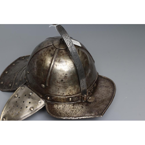 579 - A LOBSTER TAIL HELMET, part 17th century, with pointed peak, articulated neck guard, rivetted constr... 