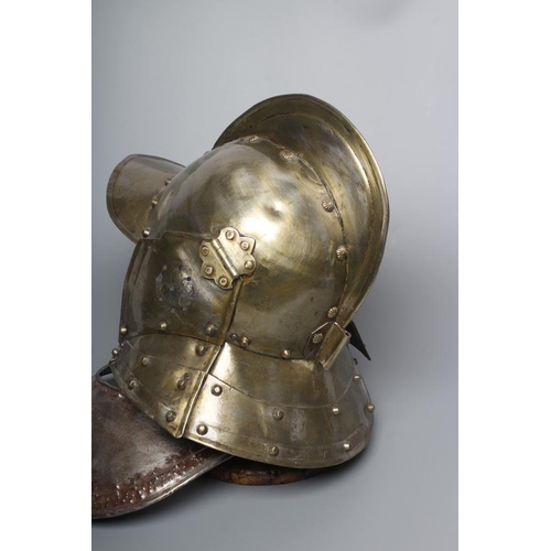 580 - A REPRODUCTION BURGONET HELMET with high medial ridge, rounded peak, neck and ear guards, together w... 