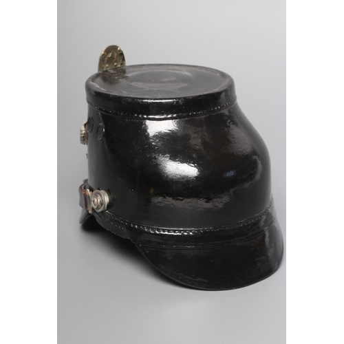 582 - A SECOND WORLD WAR GERMAN POLICE SHAKO, with large metal Third Reich eagle badge, peak, leather chin... 