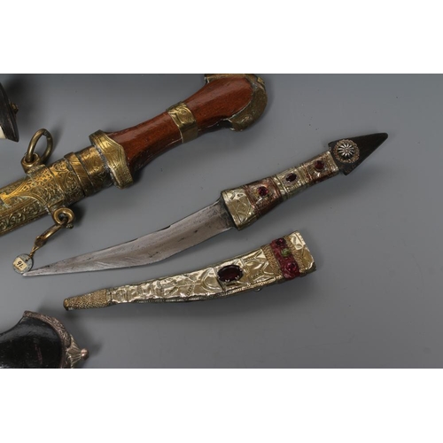 583 - FIVE DAGGERS, comprising a civilian kukri with bone handle, a Tanzanian Tribal long knife with etche... 