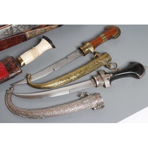 583 - FIVE DAGGERS, comprising a civilian kukri with bone handle, a Tanzanian Tribal long knife with etche... 