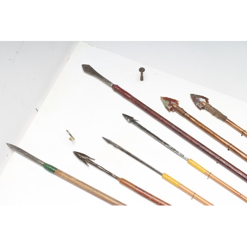 589 - A COLLECTION OF TRIBAL ARCHERY ARTIFACTS, comprising a Papua New Guinea bow, an Amazonian Piraha arr... 