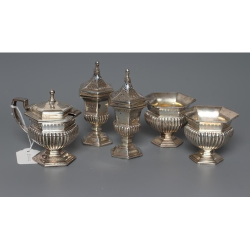 98 - A SILVER FIVE PIECE CRUET, maker Goldsmiths & Silversmiths Ltd., London 1928, of semi-fluted hexagon... 