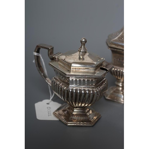 98 - A SILVER FIVE PIECE CRUET, maker Goldsmiths & Silversmiths Ltd., London 1928, of semi-fluted hexagon... 