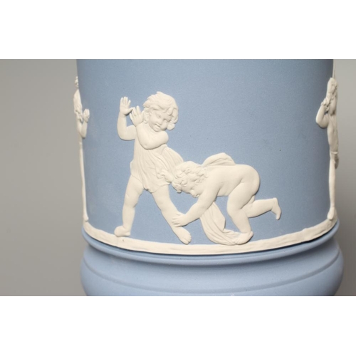 54 - A WEDGWOOD BLUE JASPERWARE PEDESTAL VASE AND COVER, modern, of cylindrical form, moulded and applied... 