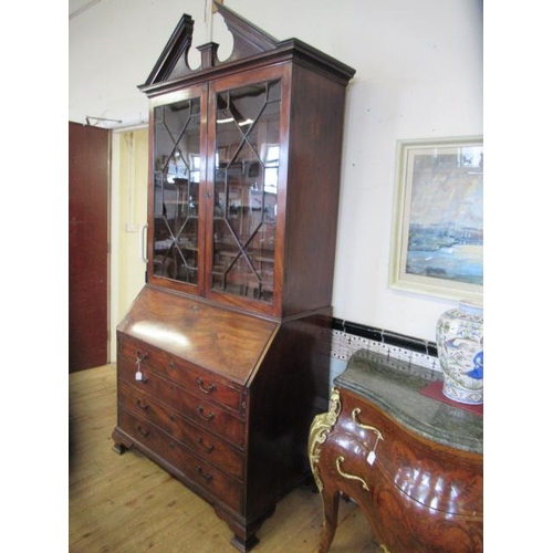 857 - A GEORGIAN MAHOGANY BUREAU BOOKCASE, third quarter 18th century, the moulded cornice with broken ped... 