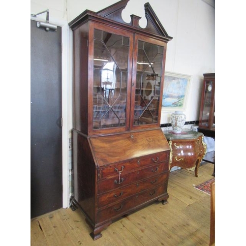 857 - A GEORGIAN MAHOGANY BUREAU BOOKCASE, third quarter 18th century, the moulded cornice with broken ped... 