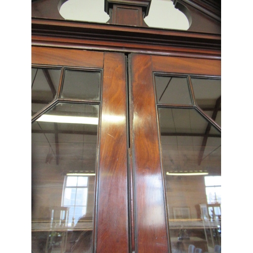 857 - A GEORGIAN MAHOGANY BUREAU BOOKCASE, third quarter 18th century, the moulded cornice with broken ped... 