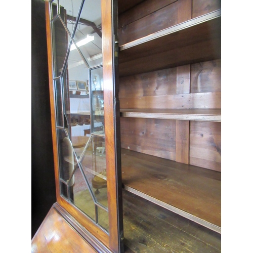 857 - A GEORGIAN MAHOGANY BUREAU BOOKCASE, third quarter 18th century, the moulded cornice with broken ped... 