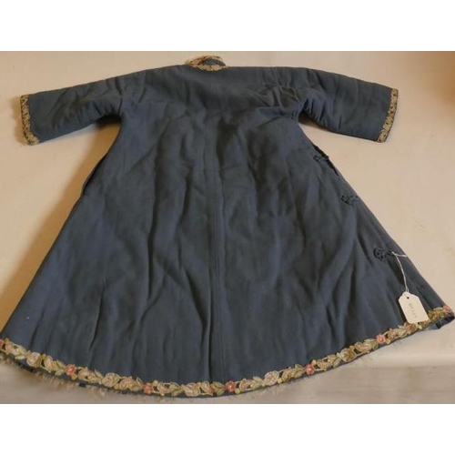 398 - A CHINESE WINTER ROBE, the plain blue woven coat with machine embroidered foliate braiding to all ed... 