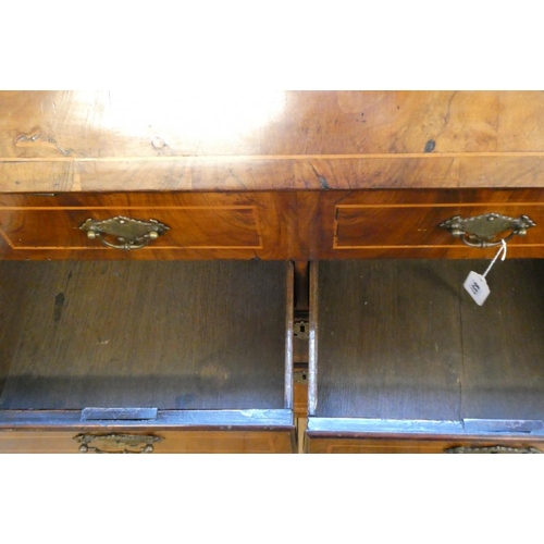 837 - A GEORGIAN WALNUT BUREAU, third quarter 18th century, the banded fallfront with stringing enclosing ... 