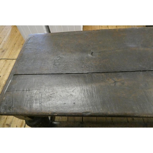 873 - A JOINED OAK DINING TABLE, 17th century and later, the cleated plank oblong top with lunette carved ... 