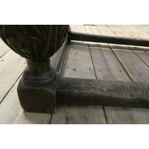 873 - A JOINED OAK DINING TABLE, 17th century and later, the cleated plank oblong top with lunette carved ... 