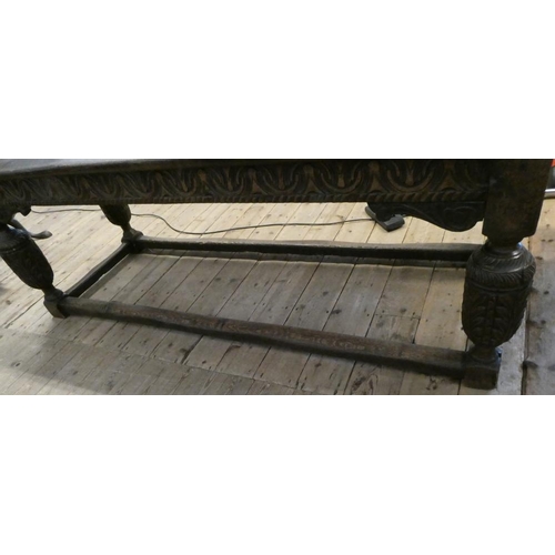 873 - A JOINED OAK DINING TABLE, 17th century and later, the cleated plank oblong top with lunette carved ... 