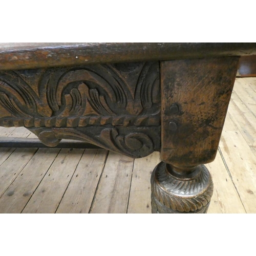 873 - A JOINED OAK DINING TABLE, 17th century and later, the cleated plank oblong top with lunette carved ... 