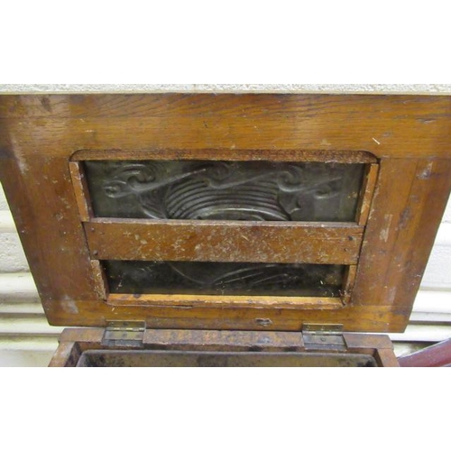 409 - AN ARTS AND CRAFTS OAK COAL BOX, c.1900, of oblong tapering form, the hinged lid and sides inset wit... 