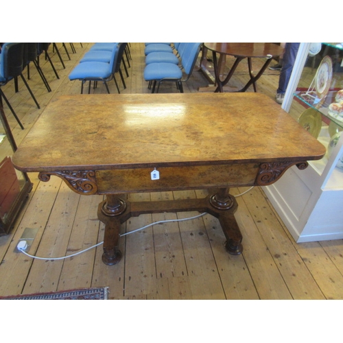 863 - AN EARLY VICTORIAN BURR OAK LIBRARY TABLE, the rounded oblong top over frieze drawer flanked on eith... 