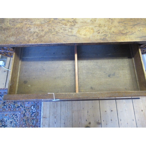 863 - AN EARLY VICTORIAN BURR OAK LIBRARY TABLE, the rounded oblong top over frieze drawer flanked on eith... 