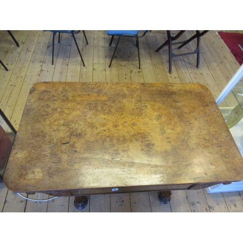 863 - AN EARLY VICTORIAN BURR OAK LIBRARY TABLE, the rounded oblong top over frieze drawer flanked on eith... 