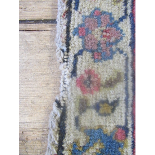 422 - A PERSIAN RUG, early 20th century, the red floral field with central navy blue gul, navy blue main b... 