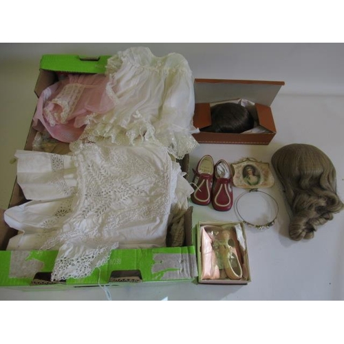 110 - A large quantity of doll accessories, including two boxed Monique wigs, three other real hair wigs, ... 