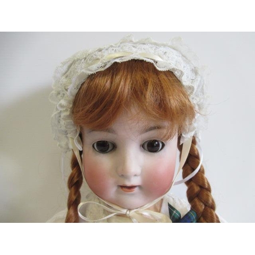 112 - An Alt, Beck & Gottschalk bisque socket head doll, with brown glass sleeping eyes, open mouth, pierc... 