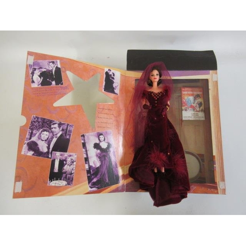 12 - Four boxed dolls, comprising two Barbie Hollywood Legends Collection Scarlett O'Hara dolls and two D... 