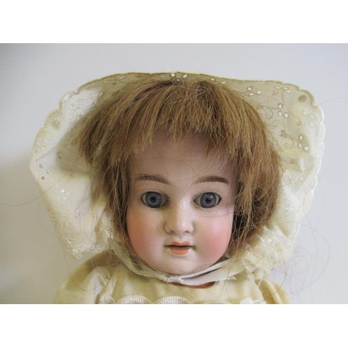 128 - A Schoenau & Hoffmeister bisque socket head doll, with blue glass sleeping eyes, open mouth, teeth, ... 