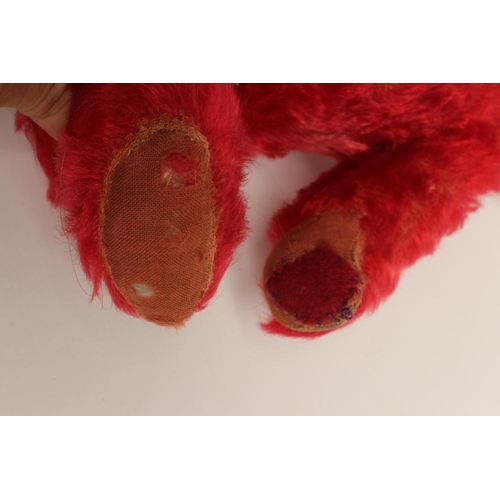 166 - A rare pre-war red teddy bear, with one amber glass eye, sewn nose, red plush and red cloth pads, 16... 