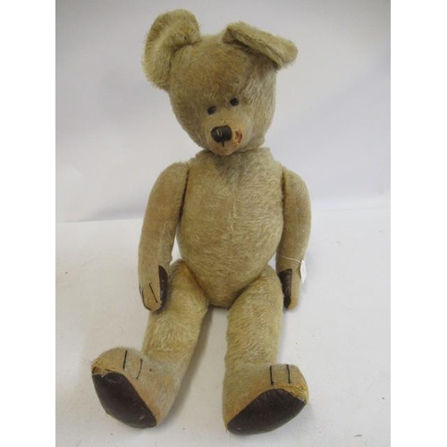 190 - A large mid-war teddy bear, with sewn eyes, sewn nose, blond plush, straw filling and leatherette pa... 