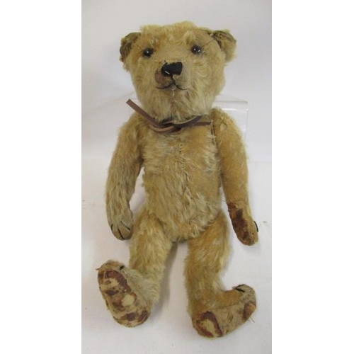 192 - A German teddy bear, c.1910, with black shoe button eyes, sewn nose, blond plush and cloth pads, 14