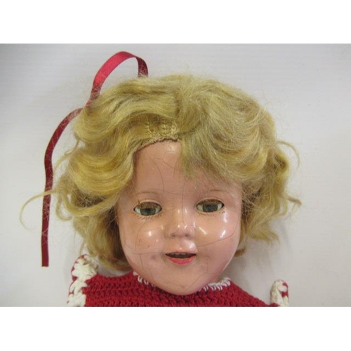 2 - A Shirley Temple doll, with composition socket head, sleeping eyes, open mouth, blond wig, compositi... 