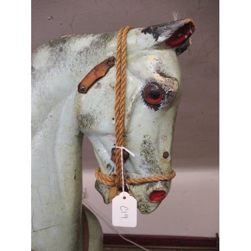 226 - A Victorian rocking horse, of carved wood construction, with mild head tilt, glass eyes, dappled gre... 