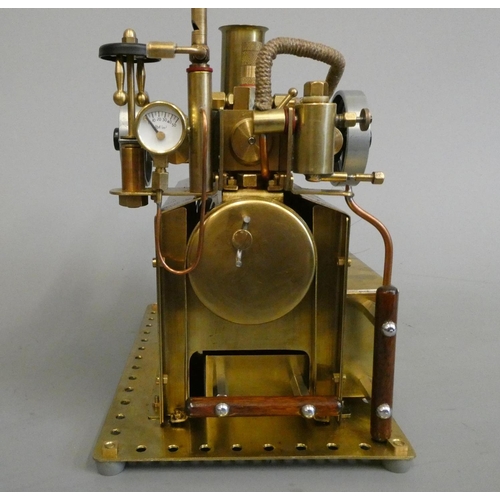 332 - Twin cylinder over-type steam engine, spirit fired boiler with water level plug, pressure gauge, bra... 