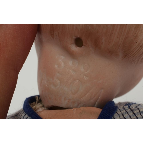 34 - An Armand Marseille bisque socket head character doll, with moulded sideways glancing eyes, painted ... 