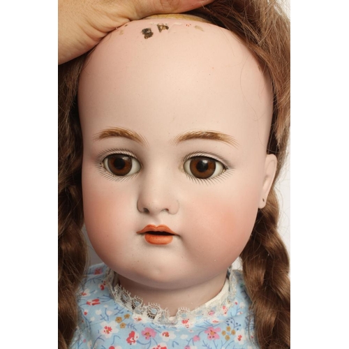 35 - A Kammer & Reinhardt bisque socket head doll, with brown glass sleeping eyes, open mouth, applied te... 