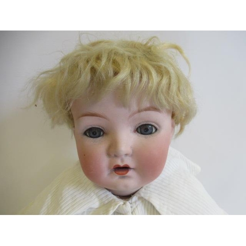 38 - A Gebruder Heubach bisque socket head doll, with blue glass sleeping eyes, open mouth, applied teeth... 