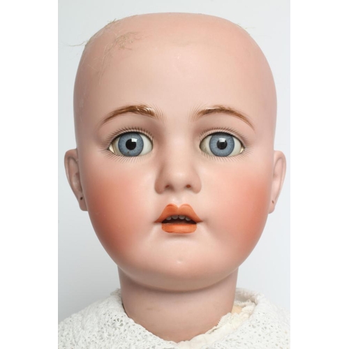 39 - A Kammer & Reinhardt bisque socket head doll, with blue glass sleeping eyes, open mouth, applied tee... 