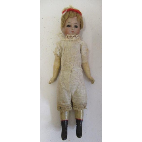 4 - An early bisque head doll, possibly French, with bisque head, brown glass fixed eyes, blond wig, woo... 