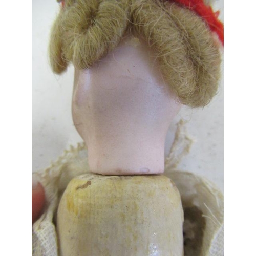 4 - An early bisque head doll, possibly French, with bisque head, brown glass fixed eyes, blond wig, woo... 