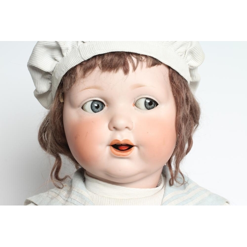 48 - A clockwork Armand Marseille bisque head character doll, with blue glass sideways glancing eyes, ope... 